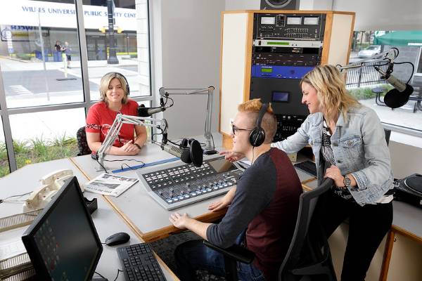 Professor Kristen Rock and students record a radio show for WCLH